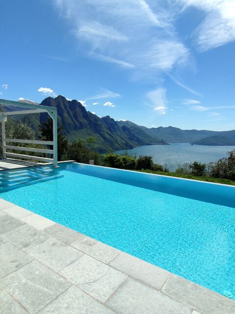 Infinity pool overlooking the rugged mountains surrounding Lake Iseo