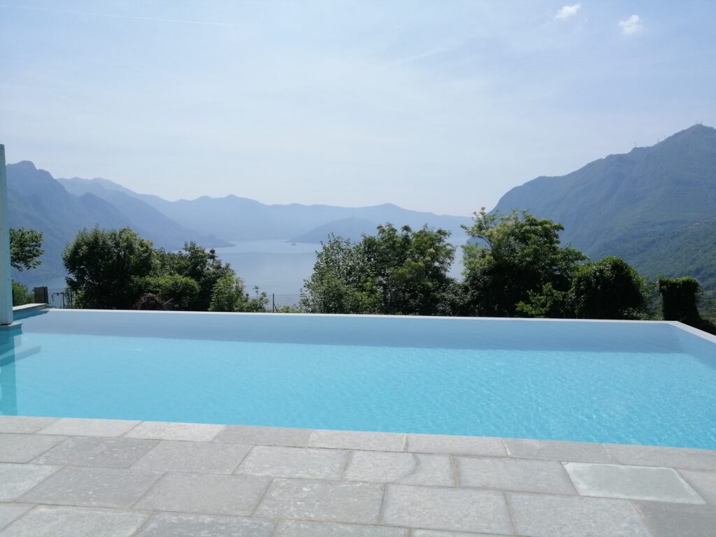 Trivia Bellavista's poolside lounge chairs facing a picturesque mountain view